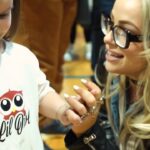 Liv Morgan Instagram – What a morning 🥹

Today on International Women’s Day,  we got to honor one of our Community Champions, @flyfwd_athletics on the road to WrestleMania 🤩

Being a female in sports changed and shaped my whole entire life. Today we got to donate 3 thousand sports bras to the beautiful young women of Philadelphia to ensure that they have the ability and resources to participate & stay in sports. 

Thank you @frankfordhs for having us 🙏 
Sending all my love to all my new besties 😉