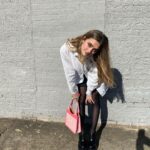 Lizzy Greene Instagram - 👛this is my moms shirt from the 80s🐈🐈‍⬛