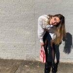 Lizzy Greene Instagram - 👛this is my moms shirt from the 80s🐈🐈‍⬛