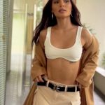 Lovi Poe Instagram - Trench exit 😉 wearing @readysetglowph Lip Souffle in Blush Pink 👄