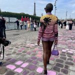 Lupita Nyong'o Instagram - Don’t forget to stop and breathe in the moment! 💜💖 Pressing pause and taking in these magnifique moments from my trip to Paris. Merci @debeersofficial and @chanelofficial for a wonderful week. 1. Chanel show with iconic Parisian view. (They painted the cobblestones to match my outfit!) 2. Summer in Paris is verdant 3. Gooooood Foooooooooood 🤤 4. Reunion with @rashidajones & @Selema 5. Love in Coco Chanel's apartment 😱😍🛋️👩🏿‍🤝‍👨🏿 6. My message for Coco Chanel 💌 7. Dreams of holding court like Coco on the iconic staircase 8. And a cheeky make-up moment!