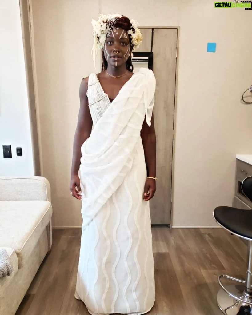 Lupita Nyong'o Instagram - Celebrating @therealruthecarter, #BlackPanther #WakandaForever costume designer(swipe ↔️ for context). Ruth is all about collaboration and cultural appreciation and here is an example: : When I went into my first fitting for #WakandaForever, Ruth was still trying to figure out Nakia's look for Ramonda's funeral. She shared some concept art with me and wanted to hear my thoughts and ideas. I had been in Kenya earlier that year, and my sister Fiona had attended a friend's Rwandan wedding in full Rwandese regalia. I was blown away by how elegant she looked, how gracefully her clothing flowed. I shared the photo with Ruth and she loved it too. So, just like that, it became the basis of inspiration for Nakia's look and this is the final result. Ruth took it and RAN a MARATHON with it! : It is one of my favorite costumes of all time. The full look did not make an appearance in the movie (you only see a close-up of my face with the incredible head piece and face paint inspired by the Omo tribe of Ethiopia) so enjoy it with me here. : And let's give Ruth all her flowers, for highlighting, preserving, elevating and inspiring afro-historic and afro-futuristic style! Congratulations on the well-deserved #Oscars win for Best Costume in a Motion Picture.