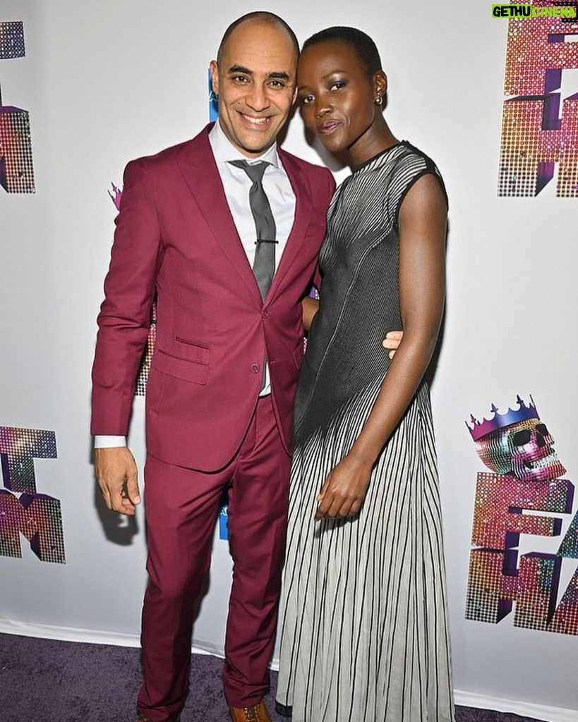 Lupita Nyong'o Instagram - One of the sweetest joys in life is watching your dear friends blossom, so let me take a moment to give it up for my heart blood, Saheem Ali (@saheemscene)🌻🌻🌻 In his directorial debut on Broadway this year, Saheem scored a Tony nomination for Best Direction of a Play for the tour-de-force, laugh-out-loud @fathambway. When I was 14 years old, Saheem and I met onstage in Kenya – he was Mercutio, I was Juliet. We didn't become friends until 15 years later when we met in NY, both out of college and trying to figure out life as immigrants. We met up at a reading of a new play, and on our walk to get some tea (like true Kenyans), he opened up to me in an unprecedented way, and I followed suit. Our friendship grew steadily from that point. We've sprouted creatively, navigated life’s thorns, and branched out together in a way that has made my life better and brighter over the last decades. So today, join me in stopping to smell the roses in honor of Saheem and all the friends who help us belong, make us belly laugh, and inspire us to invest in ourselves and our dreams. 💗🌼 I love you, Saheem! Can’t wait to celebrate you tomorrow night at the #TonyAwards. 🌟
