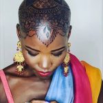 Lupita Nyong’o Instagram – THE STORY OF MY HEAD: 
I met @hennabysabeen last year at a wedding in Pakistan. She did the #HennaDesign for the bride and I was ASTOUNDED by the INTRICACY and BEAUTY of her work. There was something unique about the way she expressed herself in henna art. And I promised myself, “One day I will have a reason to work with Sabeen.”
:
1.5 years later, when I got the invitation to attend the opening night of my dear friend, Mira Nair’s @monsoonmusical, I was scrambling at the last minute to find something to wear. I borrowed a sari and jewelry from @mishajapanwala, the bride from Pakistan, but the look didn’t feel complete…
:
And then, in the middle of the night, an image SHOT into my mind of a henna design covering my bald head!!! I could do something special and different, to celebrate the culture using the canvas readily available to me! I was so excited by the idea that I could not go back to sleep. Misha connected me to Sabeen, and we were ON OUR WAY…
:
Sabeen had NEVER designed for a head before; I had never done such a thing before either. My only prompt to her was that I wanted a widow’s peak (homage to the bindhi, borla / maang tikka), the rest was ALL HER INNOVATION.  She suggested #jagua, a natural dye from the jagua fruit of South America that would be dark enough to give good contrast to my dark skin ☺️. 
:
We were both excited and terrified. What if it went wrong or looked funny??? Well, I thought, I can always wear a head wrap…. 
:
But Sabeen BROUGHT IT! We stopped now and again so that I could give her feedback because she was DETERMINED to leave me a happy client. And Sabeen was METICULOUS. She did not stop until it was perfect. When we looked at the finished head… we were both GRINNING!
:
It takes about 24 hours for the dye to really show up. And when it came in, in FULL CONTRAST the next day, I was simply MOVED. It was beautiful. It was bold and elegant; it had a point of view. We had not played it safe, and it had paid off. And I had found a new way to express myself without hair! 
:
So the moral of this story is: DARE YOURSELF TO SEEK OUT BEAUTY IN NEW WAYS. And, Sabeen, thank you for bestowing on me the beauty of your hand and history!