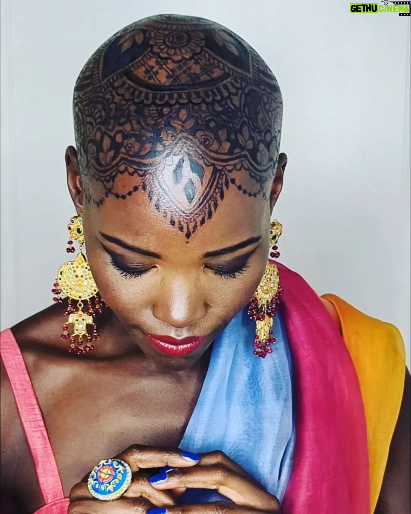 Lupita Nyong'o Instagram - THE STORY OF MY HEAD: I met @hennabysabeen last year at a wedding in Pakistan. She did the #HennaDesign for the bride and I was ASTOUNDED by the INTRICACY and BEAUTY of her work. There was something unique about the way she expressed herself in henna art. And I promised myself, "One day I will have a reason to work with Sabeen." : 1.5 years later, when I got the invitation to attend the opening night of my dear friend, Mira Nair's @monsoonmusical, I was scrambling at the last minute to find something to wear. I borrowed a sari and jewelry from @mishajapanwala, the bride from Pakistan, but the look didn't feel complete... : And then, in the middle of the night, an image SHOT into my mind of a henna design covering my bald head!!! I could do something special and different, to celebrate the culture using the canvas readily available to me! I was so excited by the idea that I could not go back to sleep. Misha connected me to Sabeen, and we were ON OUR WAY... : Sabeen had NEVER designed for a head before; I had never done such a thing before either. My only prompt to her was that I wanted a widow's peak (homage to the bindhi, borla / maang tikka), the rest was ALL HER INNOVATION. She suggested #jagua, a natural dye from the jagua fruit of South America that would be dark enough to give good contrast to my dark skin ☺️. : We were both excited and terrified. What if it went wrong or looked funny??? Well, I thought, I can always wear a head wrap.... : But Sabeen BROUGHT IT! We stopped now and again so that I could give her feedback because she was DETERMINED to leave me a happy client. And Sabeen was METICULOUS. She did not stop until it was perfect. When we looked at the finished head... we were both GRINNING! : It takes about 24 hours for the dye to really show up. And when it came in, in FULL CONTRAST the next day, I was simply MOVED. It was beautiful. It was bold and elegant; it had a point of view. We had not played it safe, and it had paid off. And I had found a new way to express myself without hair! : So the moral of this story is: DARE YOURSELF TO SEEK OUT BEAUTY IN NEW WAYS. And, Sabeen, thank you for bestowing on me the beauty of your hand and history!