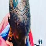Lupita Nyong’o Instagram – THE STORY OF MY HEAD: 
I met @hennabysabeen last year at a wedding in Pakistan. She did the #HennaDesign for the bride and I was ASTOUNDED by the INTRICACY and BEAUTY of her work. There was something unique about the way she expressed herself in henna art. And I promised myself, “One day I will have a reason to work with Sabeen.”
:
1.5 years later, when I got the invitation to attend the opening night of my dear friend, Mira Nair’s @monsoonmusical, I was scrambling at the last minute to find something to wear. I borrowed a sari and jewelry from @mishajapanwala, the bride from Pakistan, but the look didn’t feel complete…
:
And then, in the middle of the night, an image SHOT into my mind of a henna design covering my bald head!!! I could do something special and different, to celebrate the culture using the canvas readily available to me! I was so excited by the idea that I could not go back to sleep. Misha connected me to Sabeen, and we were ON OUR WAY…
:
Sabeen had NEVER designed for a head before; I had never done such a thing before either. My only prompt to her was that I wanted a widow’s peak (homage to the bindhi, borla / maang tikka), the rest was ALL HER INNOVATION.  She suggested #jagua, a natural dye from the jagua fruit of South America that would be dark enough to give good contrast to my dark skin ☺️. 
:
We were both excited and terrified. What if it went wrong or looked funny??? Well, I thought, I can always wear a head wrap…. 
:
But Sabeen BROUGHT IT! We stopped now and again so that I could give her feedback because she was DETERMINED to leave me a happy client. And Sabeen was METICULOUS. She did not stop until it was perfect. When we looked at the finished head… we were both GRINNING!
:
It takes about 24 hours for the dye to really show up. And when it came in, in FULL CONTRAST the next day, I was simply MOVED. It was beautiful. It was bold and elegant; it had a point of view. We had not played it safe, and it had paid off. And I had found a new way to express myself without hair! 
:
So the moral of this story is: DARE YOURSELF TO SEEK OUT BEAUTY IN NEW WAYS. And, Sabeen, thank you for bestowing on me the beauty of your hand and history!