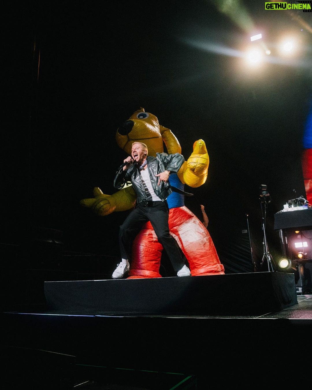 Macklemore Instagram - The Ben Tour USA made its way back home to Washington and a city that I have grown to love over the years: Spokane. It reminds me of Seattle back in the 80’s before IKEA looking condo’s and tech took over. There’s a nostalgic Americana vibe from old brick buildings, wide streets, incredible vintage missions, the Spokane river and rustic diners. Sloane and I put in miles on Lime Scooters riding all over the city and exploring the uncharted terrain. I have classic core memories shooting the Downtown music video when Sloane was a baby and shutting down multiple city blocks to throw a parade with the people of Spokane. That same energy was felt from the moment I stepped into the Spokane Arena. Someone even tracked down the inflatable dog from the music video who made a cameo on stage during Downtown. 11,000 people deep and probably the loudest crowd of the tour. A true Washington homecoming in one of my favorite PNW places ❤️ Spokane, Washington
