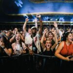 Macklemore Instagram – This tour I have fallen back in love with American venues.  I had forgotten.  They are sacred spaces that hold energy, stories, secrets, sweat, stained walls, beer riddled floors and stages that have been graced by giants who have come and gone.  They are a gathering mecca for the medicine that is music and the magic that occurs in community.  Speakers strapped to the ceiling over the heads of humans pressed up against each other screaming the words in unison.  It has been life affirming to reconnect to this love.  And when I think of venues in America one of my all time favorites is The Rave/Eagles Club in Milwaukee.  It is perfect.  In stature it is a 200,000 sq ft labyrinth, woven in tapestry’s, hidden hallways, lava lamps, a swimming pool, basketball court, an old bowling alley that was converted to a smaller venue and of course the main room.  There is no air conditioning.  It is way too hot.  It is a place where performers will be tested as will the audience, and I revel in the challenge.  The venue is almost 100 years old and is independently owned.  Every time I play there I look forward to hearing stories from the owner Leslie who refuses to sell the place to the bigger companies that have attempted to buy it.  She is a legend, a friend and a magnificent tour guide of the sprawling oasis.  The swimming pool is decorated in graffiti from all the musicians that have stepped foot on this holy ground.  I feel my brother Mac’s spirit in this space, as his eerily beautiful words sit beneath the 25 marker of the pool.  It is truly a 1 of 1 and makes me proud that my fingerprints are part of its linage.  This show marked my 3rd time there and also my 3rd time selling it out.  We gave it 100% as always…It just means something more in Milwaukee ❤️ Milwaukee, Wisconsin