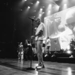 Macklemore Instagram - Nashville was our first stop of THE BEN TOUR USA. I’ve always loved this city. I have an outsiders infatuation with the hole in the wall hot chicken that is way too spicy for my digestive system, the rich lineage of country music that I’ve never listened to and the bars that I don’t drink at. It feels like the most beautiful time warp, an ode to an era of the past. It’s one of my favorite places in the world to go vintage hunting so I spent the day in pursuit of western relics, snakeskin garments and any other come ups the universe would provide. The southern charm is felt in every corner of this city and I felt such a genuine love and excitement from the fans I met before the show waiting in line. Being the first show of the tour I felt a bit nervous beforehand, which is a rare yet welcomed sensation for me these days. The historic, gorgeous and intimate Ryman auditorium is very different than the European festivals we’ve been playing the last 3 months. It’s almost like a different sport, going from massive crowds to intimate ones, but both equal in the opportunity to connect. The Nashville audience was perfectly engaged, turnt and some say they’ve never felt the floor shake like it did last night. Take that Bluegrass. It was extra special last night because my sister Kesha unexpectedly came through 30 seconds before we were about to play Good Old Days and in true Kesha form was down to just hop up on stage and do what she does best… Sing. To round out the Nashville experience after the show a handful of us went next door to the gem that is Roberts to hear the local band and struggle with what y’all call a 2 step. Shit still feels like a waltz count to me, and I eventually returned to the 2 step I learned in middle school to Jodeci. But I respect it. And I love Nashville. Thank you for setting off this tour in the best way possible. Next stop… Our nations capital. Ryman Auditorium Nashville TN