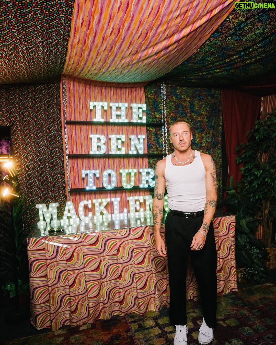 Macklemore Instagram - This tour I have fallen back in love with American venues. I had forgotten. They are sacred spaces that hold energy, stories, secrets, sweat, stained walls, beer riddled floors and stages that have been graced by giants who have come and gone. They are a gathering mecca for the medicine that is music and the magic that occurs in community. Speakers strapped to the ceiling over the heads of humans pressed up against each other screaming the words in unison. It has been life affirming to reconnect to this love. And when I think of venues in America one of my all time favorites is The Rave/Eagles Club in Milwaukee. It is perfect. In stature it is a 200,000 sq ft labyrinth, woven in tapestry’s, hidden hallways, lava lamps, a swimming pool, basketball court, an old bowling alley that was converted to a smaller venue and of course the main room. There is no air conditioning. It is way too hot. It is a place where performers will be tested as will the audience, and I revel in the challenge. The venue is almost 100 years old and is independently owned. Every time I play there I look forward to hearing stories from the owner Leslie who refuses to sell the place to the bigger companies that have attempted to buy it. She is a legend, a friend and a magnificent tour guide of the sprawling oasis. The swimming pool is decorated in graffiti from all the musicians that have stepped foot on this holy ground. I feel my brother Mac’s spirit in this space, as his eerily beautiful words sit beneath the 25 marker of the pool. It is truly a 1 of 1 and makes me proud that my fingerprints are part of its linage. This show marked my 3rd time there and also my 3rd time selling it out. We gave it 100% as always…It just means something more in Milwaukee ❤️ Milwaukee, Wisconsin