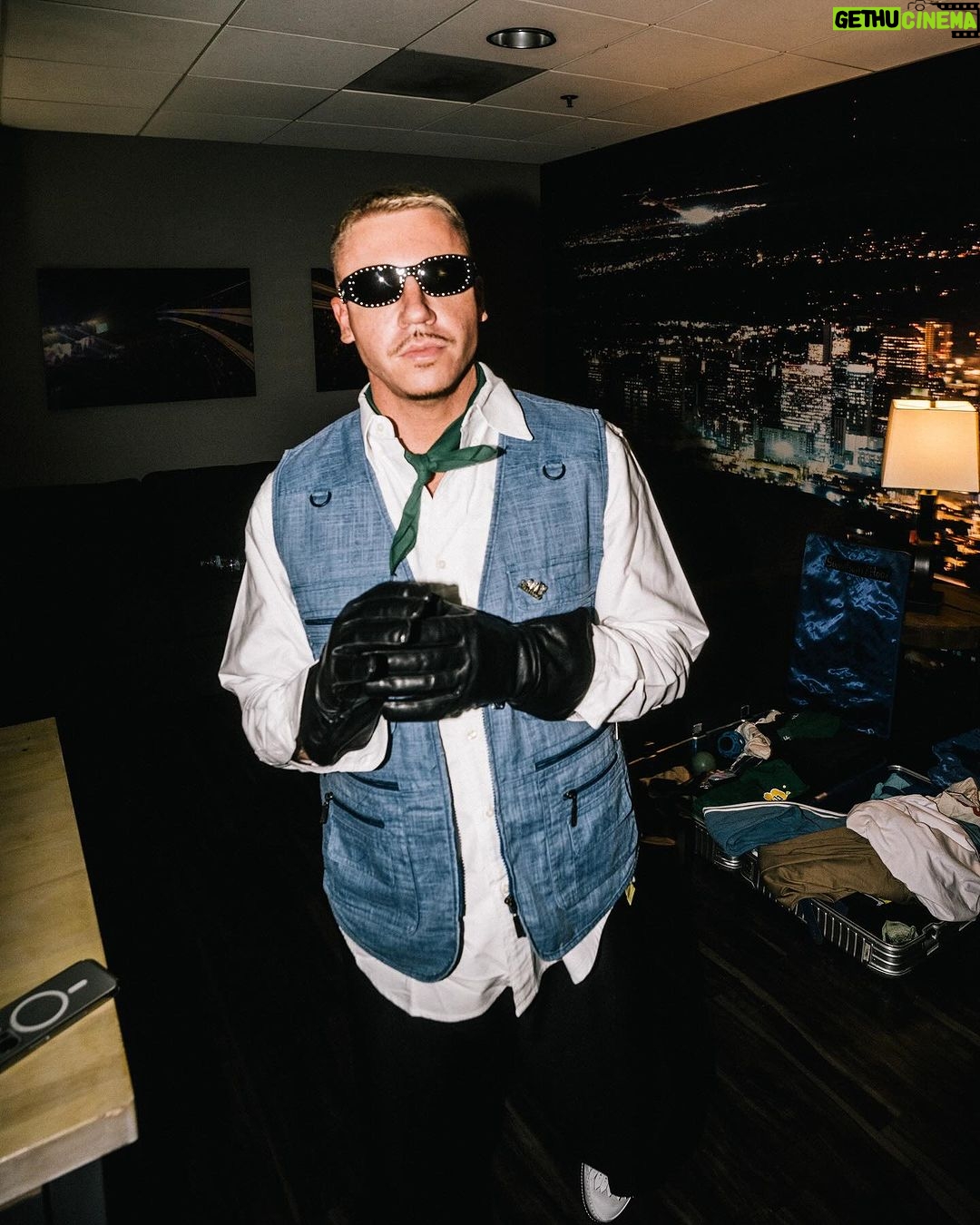 Macklemore Instagram - After a couple off days back in Seattle I landed in phoenix and was greeted by a sizzling 102 degree sun. I decided to dress up like a falcon wrangler. I met people outside that had been waiting since 9:30am to get in. We hugged, shed some tears and I felt really good in the spirit. The venue was air conditioned and dog friendly prolly. Just had that vibe that if you were a dog they’d let you chill in a hallway and give you a mini Mars bar or some shit. Anyway, I hit the stage in my falcon handling gloves and immediately felt restricted by the big tough leather covering my palms. After the first song they had to go. Bam! Threw them shits. The crowd was loose and nibble as was I, well hydrated and relatively sturdy. I was hitting a lot of spin moves to showcase how hydrated I actually was all while thinking in my head “You still got it my boy”. We laughed and some of my jokes hit. Some didn’t. Some people yawned. That always throws me off, so if you come to a show and you’re tired please hold that shit in. Anyway, the whole crowd was full of love and they sent us off stage with smiles and daps. Beautiful evening with the Cacti loving folks of Arizona. Next stop…LA for our finale show tonight.