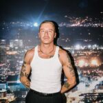 Macklemore Instagram – After a couple off days back in Seattle I landed in phoenix and was greeted by a sizzling 102 degree sun. I decided to dress up like a falcon wrangler. I met people outside that had been waiting since 9:30am to get in.  We hugged, shed some tears and I felt really good in the spirit. The venue was air conditioned and dog friendly prolly. Just had that vibe that if you were a dog they’d let you chill in a hallway and give you a mini Mars bar or some shit. Anyway, I hit the stage in my falcon handling gloves and immediately felt restricted by the big tough leather covering my palms. After the first song they had to go. Bam! Threw them shits. The crowd was loose and nibble as was I, well hydrated and relatively sturdy. I was hitting a lot of spin moves to showcase how hydrated I actually was all while thinking in my head “You still got it my boy”. We laughed and some of my jokes hit. Some didn’t.  Some people yawned. That always throws me off, so if you come to a show and you’re tired please hold that shit in. Anyway, the whole crowd was full of love and they sent us off stage with smiles and daps. Beautiful evening with the Cacti loving folks of Arizona. Next stop…LA for our finale show tonight.