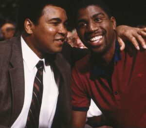 Magic Johnson Instagram - My father and I would listen to all of Muhammad Ali’s fights on the radio when I was younger. I’m still shocked that one of my childhood heroes and favorite athletes became one of my good friends because there’s no one like Muhammad Ali. To be stripped of his heavyweight title, sentenced to time in prison, and exiled from boxing for three and a half years...and then come back, reclaim the heavyweight title in 1974 against George Foreman, and be BETTER than he was before is unheard of!! His strength, dedication, and passion showed both in the ring and in the community. He is a world icon. I’ll never forget watching him carry the Olympic torch and light the cauldron in the ’96 Olympics in Atlanta. Knowing everything he overcame during his career made it an even more emotional moment for me. 
 
Out of all our memories, what will always stand out to me was when Muhammad Ali told me to meet him in Chicago to tell me he wanted me to be more than just a basketball player. It challenged me to think beyond the court. Seeing his activism and advocacy for the good of humanity and the underserved with Nelson Mandela, Malcolm X, Dr. Martin Luther King Jr., US presidents, and more inspired me to create real change. It’s those moments and impact that cement him as my G.O.A.T. and will keep his legacy alive forever!!