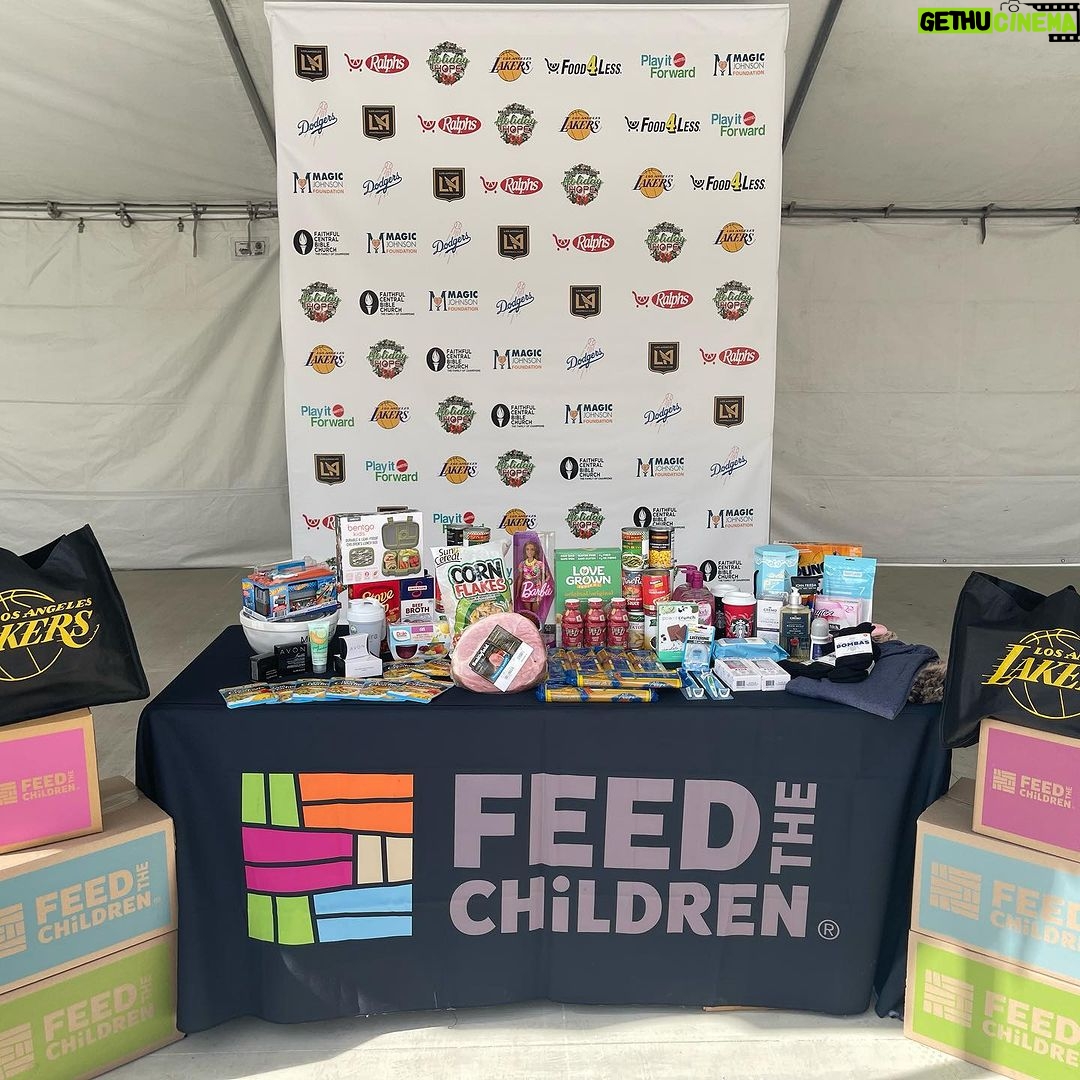 Magic Johnson Instagram - What an incredible day in Los Angeles! Cookie and I have been hosting our Holiday Hope event for almost a decade and it never gets old. Today we blessed another 800 families in need this holiday season with a 25-pound box of food, personal care items and AVON products provided by our great partners at Feed the Children. With the help of our amazing in-kind and corporate partners, families also received toys, protein snacks, eyewear, children’s books, canned food, ham and more! We can’t thank you enough for your time, kindness and support this holiday season! @feedthechildrenorg @faithfulcentral @Blueplanetecoeyeware @Powercrunch @Herbalife @Plezinutrition @Mattel @Campbells @StarKist @FarmerJohnLA @Bentgo @Dole @Lakers @Dodgers @LAFC @Rams @albalegacy @cricketwireless @commonspirithealthphilanthropy @skylar Thank you to our friends at @faithfulcentral and a special thank you to lead Pastor Dr. John-Paul C. Foster. Thank you to each and every single one of our volunteers for dedicating their time to serve the participating families and ensuring they have an amazing holiday season!! 📸: @bystokesla