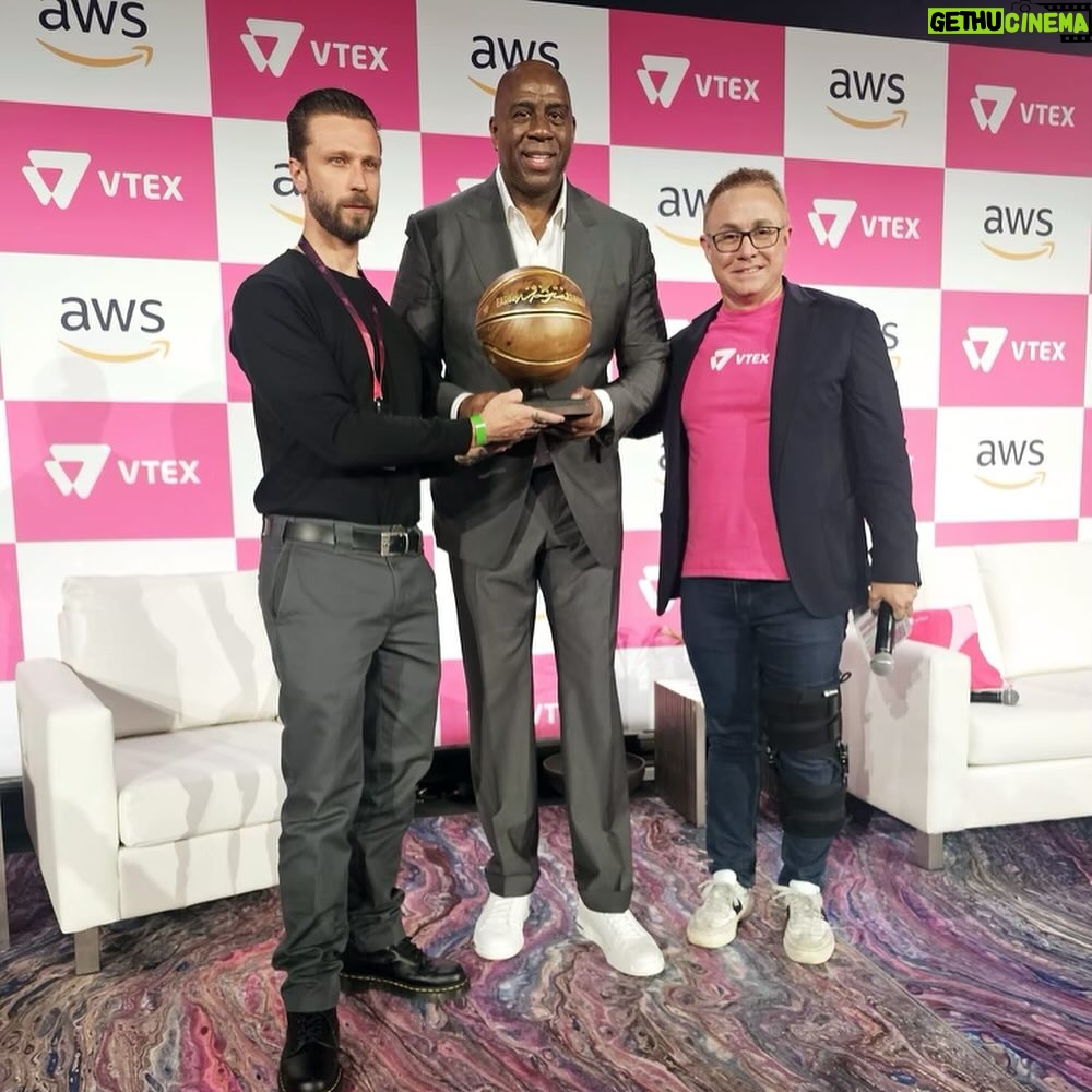 Magic Johnson Instagram - I ended an incredible day in New York City at VTEX Connect Live last night. I spoke to over 1,500 business professionals about Dr. King’s legacy, my business ventures and got to reminisce on my time on the dream team. I’m beyond grateful to independent Brazilian artist Cainã Gartner who gifted me a 300-year-old basketball made of wood and gold. Wow!! Thank you to VTEX Founder and Co-CEO Mariano Gomide De Faria for inviting me to the event! VTEX started in Brazil and has since expanded worldwide!
