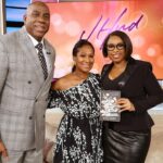 Magic Johnson Instagram - What a touching moment for me to surprise Nicole Avant, daughter of Clarence and Jacqueline Avant, during her interview! The Avant family truly has a special place in my heart, and it was such a joy to give Nicole her well-deserved flowers for the release of her new book, “Think You’ll Be Happy: Moving Through Grief with Grit, Grace, and Gratitude”. 💐