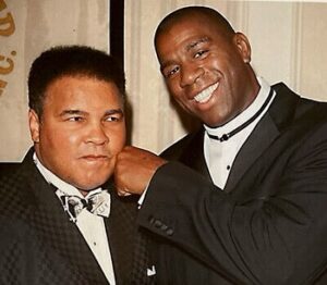 Magic Johnson Instagram - My father and I would listen to all of Muhammad Ali’s fights on the radio when I was younger. I’m still shocked that one of my childhood heroes and favorite athletes became one of my good friends because there’s no one like Muhammad Ali. To be stripped of his heavyweight title, sentenced to time in prison, and exiled from boxing for three and a half years...and then come back, reclaim the heavyweight title in 1974 against George Foreman, and be BETTER than he was before is unheard of!! His strength, dedication, and passion showed both in the ring and in the community. He is a world icon. I’ll never forget watching him carry the Olympic torch and light the cauldron in the ’96 Olympics in Atlanta. Knowing everything he overcame during his career made it an even more emotional moment for me. 
 
Out of all our memories, what will always stand out to me was when Muhammad Ali told me to meet him in Chicago to tell me he wanted me to be more than just a basketball player. It challenged me to think beyond the court. Seeing his activism and advocacy for the good of humanity and the underserved with Nelson Mandela, Malcolm X, Dr. Martin Luther King Jr., US presidents, and more inspired me to create real change. It’s those moments and impact that cement him as my G.O.A.T. and will keep his legacy alive forever!!