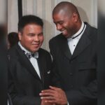 Magic Johnson Instagram – My father and I would listen to all of Muhammad Ali’s fights on the radio when I was younger. I’m still shocked that one of my childhood heroes and favorite athletes became one of my good friends because there’s no one like Muhammad Ali. To be stripped of his heavyweight title, sentenced to time in prison, and exiled from boxing for three and a half years…and then come back, reclaim the heavyweight title in 1974 against George Foreman, and be BETTER than he was before is unheard of!! His strength, dedication, and passion showed both in the ring and in the community. He is a world icon. I’ll never forget watching him carry the Olympic torch and light the cauldron in the ’96 Olympics in Atlanta. Knowing everything he overcame during his career made it an even more emotional moment for me. 
 
Out of all our memories, what will always stand out to me was when Muhammad Ali told me to meet him in Chicago to tell me he wanted me to be more than just a basketball player. It challenged me to think beyond the court. Seeing his activism and advocacy for the good of humanity and the underserved with Nelson Mandela, Malcolm X, Dr. Martin Luther King Jr., US presidents, and more inspired me to create real change. It’s those moments and impact that cement him as my G.O.A.T. and will keep his legacy alive forever!!