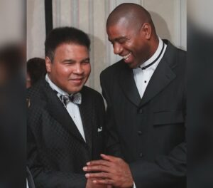 Magic Johnson Instagram - My father and I would listen to all of Muhammad Ali’s fights on the radio when I was younger. I’m still shocked that one of my childhood heroes and favorite athletes became one of my good friends because there’s no one like Muhammad Ali. To be stripped of his heavyweight title, sentenced to time in prison, and exiled from boxing for three and a half years...and then come back, reclaim the heavyweight title in 1974 against George Foreman, and be BETTER than he was before is unheard of!! His strength, dedication, and passion showed both in the ring and in the community. He is a world icon. I’ll never forget watching him carry the Olympic torch and light the cauldron in the ’96 Olympics in Atlanta. Knowing everything he overcame during his career made it an even more emotional moment for me. 
 
Out of all our memories, what will always stand out to me was when Muhammad Ali told me to meet him in Chicago to tell me he wanted me to be more than just a basketball player. It challenged me to think beyond the court. Seeing his activism and advocacy for the good of humanity and the underserved with Nelson Mandela, Malcolm X, Dr. Martin Luther King Jr., US presidents, and more inspired me to create real change. It’s those moments and impact that cement him as my G.O.A.T. and will keep his legacy alive forever!!