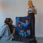 Maisie Williams Instagram – red hot pistol girls 🔫 🥵
a portrait reimagined by the angel @_samwootton_ 

snap of us: @julia.hovve 
original portrait: @miya_mizuno_stills 

art inspires art 🌱
