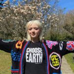 Maisie Williams Instagram - It’s Earth Day 🌎 and I ask you to CHOOSE EARTH! My friends over at @chooselove have launched a campaign raising desperately-needed funds for the incredible Brazilian indigenous leaders dedicating their lives to protecting the rainforest from destruction. This work is a vital part of the battle against climate change and is essential for the future of our planet. There’s the link in @chooselove bio to donate or you can buy one of these fabulous organic cotton tees (printed to order) and 100% of profits from the merch go to the Choose Earth fund! Protect our planet🌱 Choose Love🤍 CHOOSE EARTH!✨