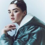 Maisie Williams Instagram - i teamed up with Shoreditch Ski Clurb to create the exclusive Mazi Coat - designed to keep you warm on-set and off-duty alike. all profits will be donated to @themaziproject, the Bristol-based, youth-led charity empowering disadvantaged 16-25 year olds through food, whilst supporting care leavers, young asylum seekers and those recovering from homelessness and fleeing domestic violence. available exclusively on shoreditchskiclub.com @shoreditchskiclub Creative Director @wilbeedle Photographer @amitisraeli1 Stylist @danielleemerson Director @robertnetherystudio Hair Stylist @kotasuizu Make-up Artist @mathiasvanhooff