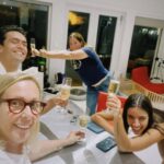María Gabriela de Faría Instagram - I’m very happy and can’t shut up about it so here’s a compilation of moments after I found out @jamesgunn had invited me to play Angela, The Engineer. 1) I immediately bought a Superman cape at Party City. 2)Surprised my agent at his office with his own cape and champagne. 3-4) My Godmothers got pretty excited and we all pretended to fly. 5) I sent my parents a Superman action figure to Venezuela and that’s how I let them know I got the role. Don’t mind my dad’s words, he loves me. 6) They proceded to send me all of the gifts available with a Superman theme. 7) I walked around town with the Party City cape like a child after a birthday party. 7) Angie ❤️ • • • Estoy muy feliz y no se me quita, así que aquí hay una recopilación de momentos después de que @jamesgunn me invitara a interpretar a Angela, The Engineer. 1) Inmediatamente compré una capa de Superman en Party City. 2) Sorprendí a mi agente en su oficina con su propia capa y champaña. 3-4) Mis Madrinas se emocionaron mucho y por un rato jugamos a que Catha volaba. 5) Le envié a mis papás una figura de acción de Superman a Venezuela y así les hice saber que conseguí el papel. No le hagan caso a las palabras de mi papá, él me ama 🤣 6) Mis papás procedieron a enviarme todos los regalos disponibles con temática de Superman. 7) Caminé por la ciudad con la capa de Party City como un niño después de una fiesta de cumpleaños. 7)Angie❤️