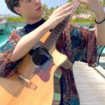 Marcin Patrzalek Instagram - Another unpublished one from the Maldives, not sure about the outfit tho 🧐 #guitar #maldives
