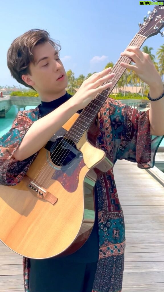 Marcin Patrzalek Instagram - Another unpublished one from the Maldives, not sure about the outfit tho 🧐 #guitar #maldives