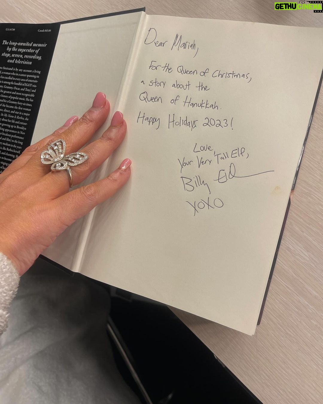Mariah Carey Instagram - πΆ Living like Babs cause itβs Evergreen πΆ Reading the incredible memoir by @barbrastreisand on the tour bus!πβ€οΈ Thank you for the gift and the fabulous dedication @billyeichner π