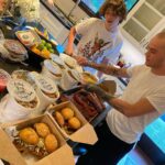 Mark Sheppard Instagram - My boys opening up the bounty that is @sweets2savory delivery! Incredible food from my old friend Chef @timabell Homemade sausage, brisket, pulled pork with vinegar sauce, sous vide pork belly sliders, smoked pork ribs, polenta fries, greens and beans!!!! If you are in LA, give them a try. #supportlocalbusiness Studio City