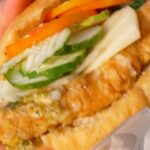 Mark Wiens Instagram - Bake and Shark! Most famous beach burger in Trinidad and Tobago! 🇹🇹 The freshness and seasoning makes it so good! #visitTrinidad @booktrinidad 📍Uncle Sam and Son’s #TrinidadandTobago #MaracasBay Uncle Sam & Sons