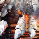 Mark Wiens Instagram - Fresh fish roast on the beach in Dakar, Senegal! 🇸🇳 Seafood mountain!! #Dakar #Senegal @papetatandiaye