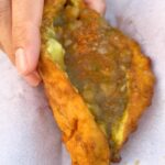 Mark Wiens Instagram - Amazing street food in Trinidad and Tobago 🇹🇹!! One of my favorites, baigan pie - eggplant wrapped in dough, deep fried, then loaded up with curry chickpeas and peppa sauce - happiness. Can’t wait to share the full videos with you, coming soon! Thanks to @booktrinidad #VisitTrinidad and @foodietaleswithzaak #Trinidad #streetfood