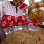 Mark Wiens Instagram - Celebration food in Senegal!! 🇸🇳 Local couscous made with millet and baobab tree sap, with whole goat tomato stew - check out the finished dish, so good! Thank you to Moussa and family and @papetatandiaye #Senegal #Africa