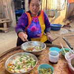 Mark Wiens Instagram - Amazing meal with a Lisu Hill-tribe family. Khao raem fuen (ข้าวแรมฟืน), basically rice jelly, cut into chunks and made two ways - one with tomato 🍅 and minced pork, another served cold with pickled mustard greens 🥬. 📍 Many thanks to Lisu Lodge @asian_oasis #ChiangMai #Thailand #Lisu #villagefood