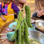 Mark Wiens Instagram - Amazing meal with a Lisu Hill-tribe family. Khao raem fuen (ข้าวแรมฟืน), basically rice jelly, cut into chunks and made two ways - one with tomato 🍅 and minced pork, another served cold with pickled mustard greens 🥬. 📍 Many thanks to Lisu Lodge @asian_oasis #ChiangMai #Thailand #Lisu #villagefood