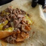 Mark Wiens Instagram - Incredible breakfast burrito @losdos_chingones Watch how they make it!! With @mexi_papa_adventures and @jeffrey_merrihue #MexicanFood #LosAngeles Los Angeles, California