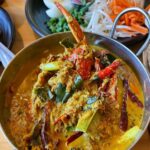 Mark Wiens Instagram - Missing Thai food! @luv2eat.thaibistro to the rescue! Phuket style southern Thai food, don’t miss the amazing crab 🦀 curry with rice noodles (ขนมจีน น้ำยาปู). And my first time to eat stink beans in the US = happiness 😅 with @paidonnnn @mmilkmilkmilk #ThaiFood #LosAngeles #LAFood Luv2eat Thai Bistro