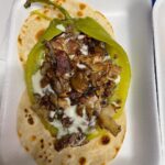 Mark Wiens Instagram - One of the great taquerias of #Tucson, this is the Taco Yaqui, an open faced green chile, cheese, bacon, carne asada, on overlapping flour tortillas. #MexicanFood #Sonora #tacos #Tucson Aqui Con El Nene