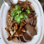 Mark Wiens Instagram - Bangkok’s best braised goose! With @itan @pongtap_lunlaman @baanpukaidong #Bangkok #Thailand 📍อุไร ห่านพะโล้ Urai Han Paloe อุไร ห่านพะโล้ ทรงวาด