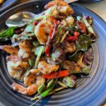 Mark Wiens Instagram - Missing Thai food! @luv2eat.thaibistro to the rescue! Phuket style southern Thai food, don’t miss the amazing crab 🦀 curry with rice noodles (ขนมจีน น้ำยาปู). And my first time to eat stink beans in the US = happiness 😅 with @paidonnnn @mmilkmilkmilk #ThaiFood #LosAngeles #LAFood Luv2eat Thai Bistro