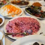 Mark Wiens Instagram - Persian food tour with @gooshtlovers It was a honor to have a huge Persian banquet sized lunch @raffisplace with Mr. and Mrs. Raffi. When they opened their restaurant 28 years ago, they had 4 tables. Now it’s one of the biggest and best Persian restaurants in the United States! #PersianFood #Iran #kebab #koobideh #LosAngleles Raffi's Place