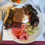 Mark Wiens Instagram - Persian food tour with @gooshtlovers It was a honor to have a huge Persian banquet sized lunch @raffisplace with Mr. and Mrs. Raffi. When they opened their restaurant 28 years ago, they had 4 tables. Now it’s one of the biggest and best Persian restaurants in the United States! #PersianFood #Iran #kebab #koobideh #LosAngleles Raffi's Place