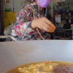 Mark Wiens Instagram - For 20 years, she’s been making the best fried curry fish balls with holy basil, served over rice noodles in Petchaburi, Thailand 🇹🇭 📍 Khanom Jeen Tod Man Jae Kiang (ร้านขนมจีนทอดมันเจ้เกียง) Petchaburi, Phetchaburi, Thailand