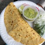 Mark Wiens Instagram - Mexican street food with @mexi_papa_adventures in Los Angeles! @tacoslospoblanosestilotijuana makes fresh masa tortillas, with grilled carne asada 🥩 and chorizo, and salsas. We had the fully loaded quesadilla, must eat when you’re in #LosAngeles #MexicanFood Tacos los Poblanos #1 Estilo Tijuana