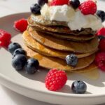 Mark Wright Instagram - Banana Blueberry Protein Pancakes 🥞🤤 Course I had to make some pancakes today but with a healthy twist… and trust me this version is such a winner. Ingredients listed below, all you need to do is pop everything in a blender till smooth then fry in a pan on a medium heat as normal (I used a little bit of olive oil for this). Use some foil to keep your pancakes warm as you cook your stack! Top with whatever you like, I went for protein yoghurt, blueberries, raspberries and honey. 1 banana 75g oats 3 eggs 2 scoops of Vanilla protein Splash of milk (any you like) 1 teaspoon of baking powder Handful of blueberries Toppings of your choice! Follow @_livewright_ for more healthy recipes you actually want to eat and that anybody can cook!