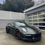 Marques Brownlee Instagram - I love electric cars, but as I've said on the Auto Focus channel there are certain TYPES of vehicles that with today's tech are BEST when made electric. Take a luxury sedan - what do you want from the best one? It better be super smooth, comfortable, quiet (and probably expensive). A new electric version? Literally the smoothest, quietest, most spacious version ever. (also probably expensive). Total win across the board. But sports cars are not one of those things. Yet. The power is there, duh, but there's also a ton of weight that comes with it. And the best sports car across the board rivers best when it's lighter, nimble and reliable. The gap is closing (and hybrids are getting VERY good) out the apex sports car is still not fully electric. Honestly I was nervous to get it after watching basically every review on the internet proclaiming this to be the "best car ever created" and "too good" but the professionals were on to something. I'm not ready to say it's the best car ever made, but most of its traits are already top 5% of any car I've ever experienced: Handling, steering feel, balance, physical switches, interior build quality, speakers, acceleration (ok it's 8/10ths as quick as PLAID) The tech is actually kinda bad compared to new EVs. The backup camera is weak, there's no phone key, the app does almost nothing, no dashcam, wireless CarPlay/Android Auto are welcome but also honestly still not very good. I don't even think that's a hot take. I've compared smartphones to the Porsche 911's incremental improvement model for years. When the category is young, we call it lazy. When the category is mature, we call it refinement. And I'm only 700 miles in, but damn this car is REFINED as hell. So this is the new daily 🤓 It's no Carrera GT (♥️ @dougdemuro) but it's MY Turbo S and i love this thing For the Porsche nerds 2024 992 Turbo S Jet black metallic + Stealth PPF PASM, PCCB, Sports Aero, Front axle lift, glass roof Chalk stitching Carbon mirror caps, door trim, GT steering wheel Wheels powder coated, brakes painted and glossy hood stripe by @autopolishingcenter Is there a 992.2 hybrid refresh coming? Yes. Worth upgrading? I guess we'll see 😈