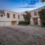 Mary Fitzgerald Instagram – Just Listed – 1375 N. Doheny Dr. – $28,500,000
5 Beds / 9 Baths / 10,613 Sq. Ft. / 17,438 Lot Size
Recently gracing the prestigious cover of Architectural Digest, this estate stands as an embodiment of timeless sophistication, meticulously curated from materials all over the world to create one of the most special homes in all of Los Angeles. Discreetly concealed beyond a privately gated driveway, an oversized motor court is laid with 200+ year-old reclaimed cobblestone from the historic streets of Boston. Experience the epitome of refined living with an open floor plan, double-height ceilings, and palatial steel-framed Crittal sliding glass doors which seamlessly unite the interior/outdoor spaces including a serene pool, covered patio, and verdant lawn. The sensuous chef’s kitchen is an epicurean haven boasting custom bronze-patinated cabinets, top-of-the-line appliances including floating burners by Pitt, and 20 slabs of book-matched Calacatta marble bearing an Rorschach-like allure. The owner’s suite bath, inspired by Jean Michel Frank – a French art deco architect known for his soft, undulating lines – stands as the quintessence of unparalleled elegance and decadence; every square inch has been cocooned in 40 slabs of Calacatta Breccia Capraia, (an impossibly rare marble from Italy that was used throughout Italian churches for hundreds of years) including the steam shower’s built-in chaise lounge to the monolithic tub hewn from a single block of stone, all paired with opulent Waterworks fixtures. Bespoke amenities include an office wrapped in an envelope of reclaimed French Oak, a state-of-the-art theater, wine cellar, gym, recreation room, private library, unrivaled security, and audio/visual integration. Unquestionably the most impressively crafted and composed property available, tailored for the most discerning buyer desiring perfection.
Listed by
@themarybonnet @jasonoppenheim