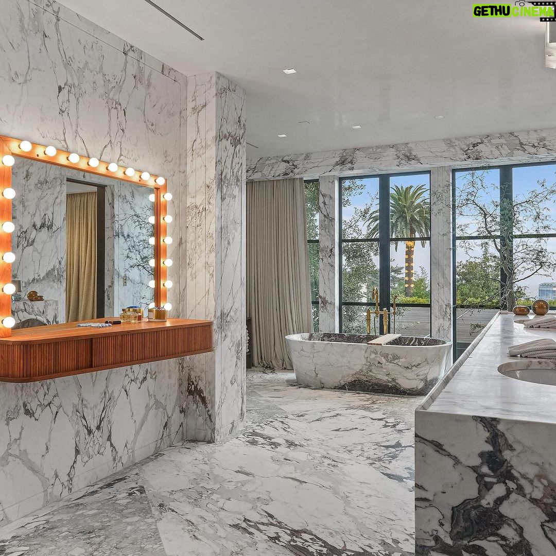 Mary Fitzgerald Instagram - Just Listed - 1375 N. Doheny Dr. - $28,500,000 5 Beds / 9 Baths / 10,613 Sq. Ft. / 17,438 Lot Size Recently gracing the prestigious cover of Architectural Digest, this estate stands as an embodiment of timeless sophistication, meticulously curated from materials all over the world to create one of the most special homes in all of Los Angeles. Discreetly concealed beyond a privately gated driveway, an oversized motor court is laid with 200+ year-old reclaimed cobblestone from the historic streets of Boston. Experience the epitome of refined living with an open floor plan, double-height ceilings, and palatial steel-framed Crittal sliding glass doors which seamlessly unite the interior/outdoor spaces including a serene pool, covered patio, and verdant lawn. The sensuous chef’s kitchen is an epicurean haven boasting custom bronze-patinated cabinets, top-of-the-line appliances including floating burners by Pitt, and 20 slabs of book-matched Calacatta marble bearing an Rorschach-like allure. The owner’s suite bath, inspired by Jean Michel Frank - a French art deco architect known for his soft, undulating lines - stands as the quintessence of unparalleled elegance and decadence; every square inch has been cocooned in 40 slabs of Calacatta Breccia Capraia, (an impossibly rare marble from Italy that was used throughout Italian churches for hundreds of years) including the steam shower’s built-in chaise lounge to the monolithic tub hewn from a single block of stone, all paired with opulent Waterworks fixtures. Bespoke amenities include an office wrapped in an envelope of reclaimed French Oak, a state-of-the-art theater, wine cellar, gym, recreation room, private library, unrivaled security, and audio/visual integration. Unquestionably the most impressively crafted and composed property available, tailored for the most discerning buyer desiring perfection. Listed by @themarybonnet @jasonoppenheim